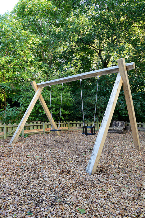double wooden playground swing